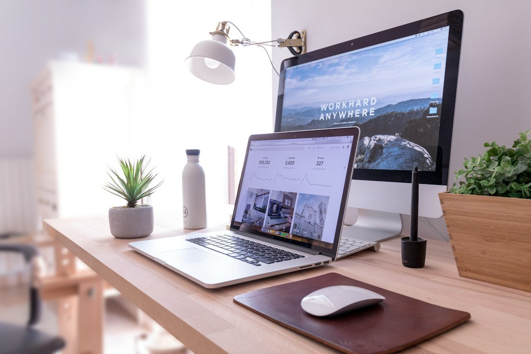 Laptop on a desk showing a website, used to compare choosing Framer or WordPress for a business site