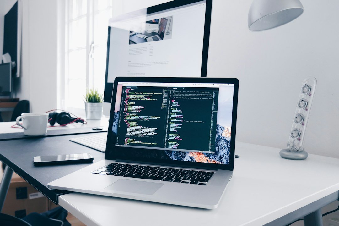 Laptop with code on screen used for WordPress AI development