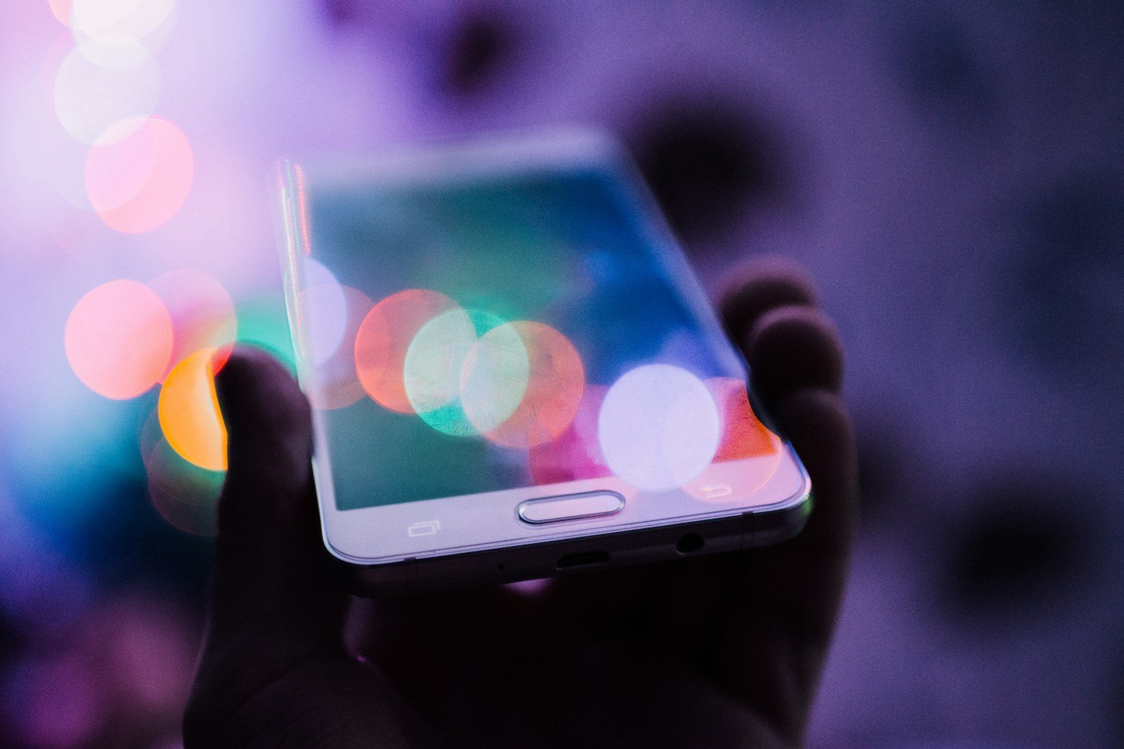 Person holding a smartphone while browsing a site