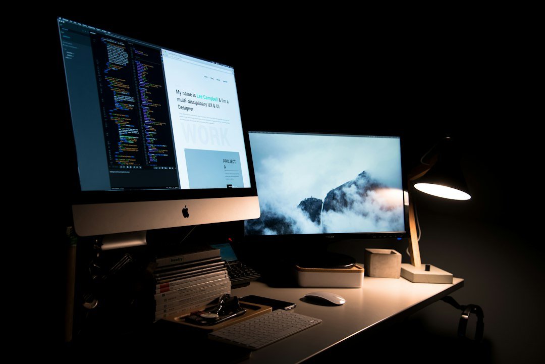 Two-screen design desk, comparing Webflow and WordPress as website options