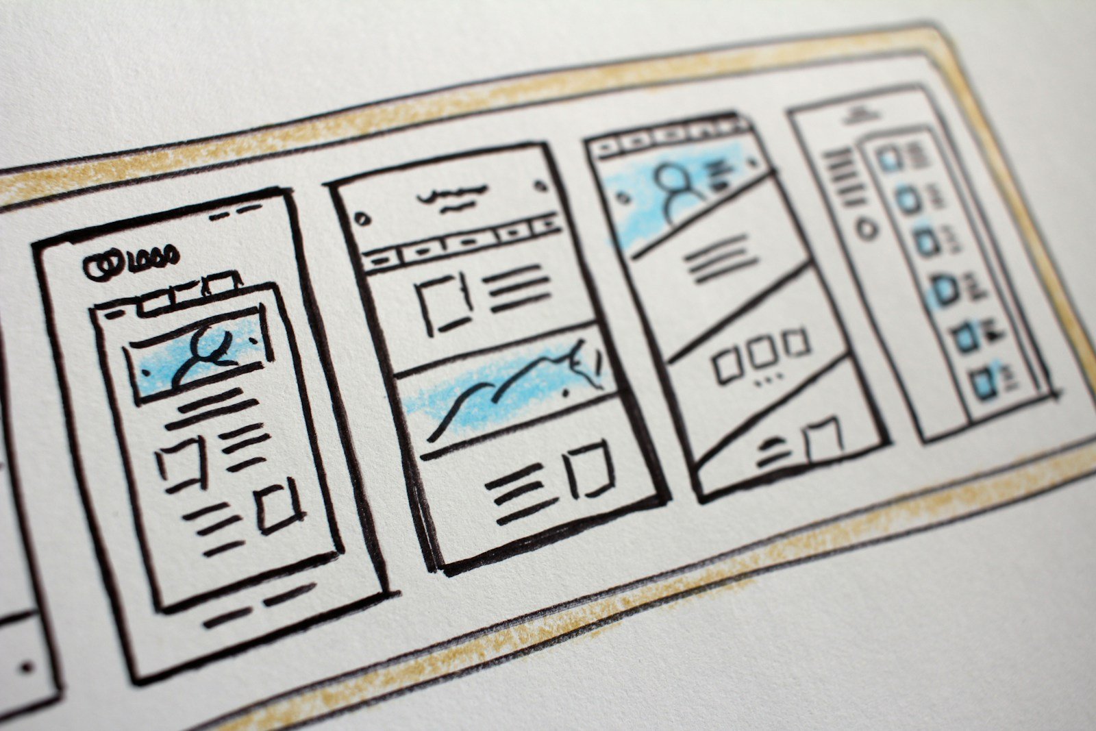 Website layout doodles on a desk used to plan a campaign site